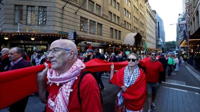 SYDNEY, AUSTRALIA - JUNE 08: Demonstrators carry a long piece of red fabric while marching along Market Street during a Pro-Palestine protest for Gaza on June 08, 2025 in Sydney, Australia. Organisers called on participants to wear the colour red to form a 'red line of humanity' while marching through the central business district (CBD). They are calling on the Australian Government to place sanctions on Israel. Picture: Lisa Maree Williams