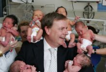 Then-treasurer Peter Costello with new born babies at Royal Women's Hospital in 2005. Picture: David Caird